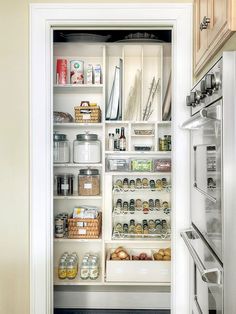 an open refrigerator door in a kitchen