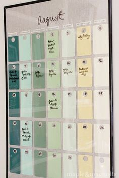 a framed calendar with the words august written in cursive writing on each side