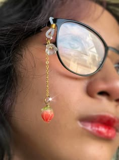 Adorable strawberry glasses charm made with gold tone chain, beautiful resin strawberry, and tiny white flower. This chain has a silicone loop to quickly attach on any pair of glasses for a cute and unique addition to your outfit!  Chain is approximately 2 inches long Check out the rest of my store for many more unique glasses chains and jewelry! Strawberry Glasses, Chains Aesthetic, Diy Glasses, Unique Glasses, Glasses Chains, Strawberry Flower, Glasses Strap, Unique Sunglasses, Cool Glasses