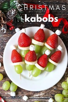 christmas kabobs on a plate with grapes, strawberries and marshmallows