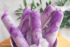 purple and white candy sticks in a bowl