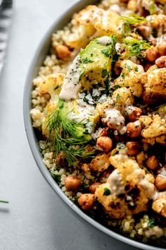 a bowl filled with cauliflower and chickpeas