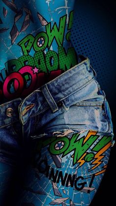 a pair of blue jean shorts with graffiti on them