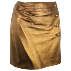 - Chanel bronze metallic lambskin leather wrap skirt from Fall 1996 collection. - Featuring four bronze metallic "CC" buttons down the side and a hook on the side closure. - Lined w CC lining. - Made in France. - Size 40. - Waist: 28 inches. Length: 15.5 inches. - 100% Lambskin. Double Lining: 100% Silk. Leather Wrap Skirt, Olive Skirt, Chanel Skirt, Leather Skirt Outfit, Wrap Skirts, Button Up Skirts, Brown Skirt, Metallic Skirt, Vintage Skirts