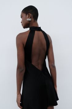 We recommend sizing down in this style.    Cut a fine figure in CLAIRE, our A Line Mini Dress that sets heart-rates high and heads turn. She might be backless but she's always got your back, Claire's a mini with maximum attitude with a high-collar neckline contrasting against a sexy low cut finish. Made from an arresting satin-like fabrication, she’s one smooth operator.     This dress is considered a Micro Mini Dress and measures shorter than 82cm from shoulder point    FEATURES:    Halter neckline  Ruched neck band  Self covered buttons to nape  Open back  A line silhouette  Mini length   FIT, FABRIC & CARE:   Victoria is 170cm/5'7 and wears a size S   Length (Size S):  78cm    Main:  53% Viscose, 47% Rayon;  Lining:  100% Polyester   Stretch Factor:  0/3  Designed exclusively for MESHKI Dresses Date Night, Party Rompers, Black Dress Prom, Date Night Dresses, Black Wedding Dresses, Printed Rompers, New Tops, White Mini Dress, Low Cut