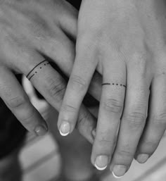 two people with wedding rings on their fingers