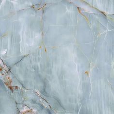 the marble is very light blue and has gold veining on it's sides