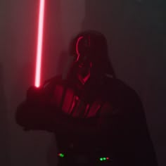 a person with a light saber in their hand