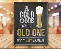 a sign that says, a cold one for the old one happy 30 th birthday