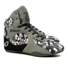 a pair of sneakers with black and white designs on the upper part of them,