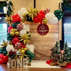 christmas decorations and balloons are on display in an office