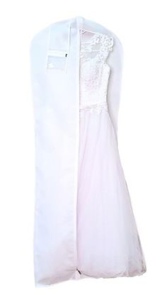 the back of a white dress hanging on a hanger with lace and tulle