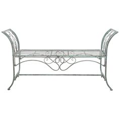 a wrought iron bench with glass shelves on the top and bottom, against a white background