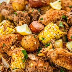 corn on the cob with potatoes and meat