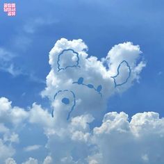 there is a cloud shaped like a teddy bear in the sky with clouds around it