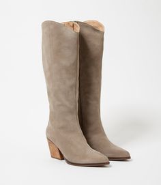 Crafted from soft suede, these pointed toe Western high boots are the perfect addition to any fall wardrobe. Pair them with jeans, skirts, or dresses for a versatile and stylish look that's perfect for the season's colors. With a sleek design and comfortable fit, these boots are a must-have. True to size Upper/Lining: Suede Leather Heel height: 3" Platform: 0.25" Shaft Height:17" Shaft Circumference: 14.5" Pointed toe shape Full zipper closure at inner ankle Imported Seychelles | Karen Kane Poin Fall Suede Heeled Boots With Wide Calf, Fall Wide Calf Suede Heeled Boots, Chic Snip Toe Knee-high Boots For Fall, Casual Suede Heeled Boots With Snip Toe, Fall Wide Calf Suede Knee-high Boots, Fall Suede Knee-high Boots With Pointed Toe, Fall Suede Knee-high Boots, Knee-high Suede Boots For Spring, Tall Shaft Suede Boots For Spring