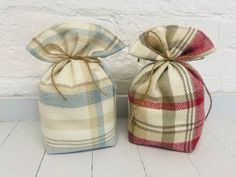 two plaid bags sitting next to each other