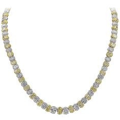 A spectacular high-end necklace, showcasing 43 oval cut fancy yellow diamonds weighing 31.14 carats total, set on 18K yellow gold. Alternates elegantly with 43 oval brilliant cut diamonds weighing 23.61 carats total, set on a 18K white gold. Made with polished platinum with invisible clasp for maximum brilliance. Roman Malakov is a custom house, specializing in creating anything you can imagine. If you would like to receive a special quote on a custom piece, please message or call us. Diamond Tennis Necklace, Fancy Yellow Diamond, Yellow Diamonds, Oval Necklace, Jewelry Showcases, Tennis Necklace, Expensive Jewelry, Men's Necklace, Diamond Set