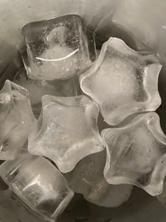 ice cubes in a metal bowl filled with water