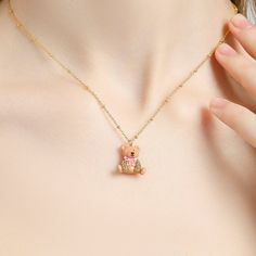 Unlock your inner sweetness with this Candy Bear Necklace, crafted using an enamel finish in a captivating candy color. Its adorable bear design will add a touch of whimsy to any outfit, bringing a classic flair with a hint of the luxurious. DETAILS Plating: 18K Gold Materials: 18K Gold on Brass, Enamel, Cubic Zirconia Size:  Length: 16.33"(41.5cm) + Extender: 1.77"(4.5cm) Weight:  12.3g Cat Pendant Necklace, Unique Gift Wrapping, Blue Candy, Bear Necklace, Horses Pendant, Bear Pendant, Cat Pendants, Globe Pendant, Bear Design