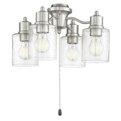 three light bathroom fixture with clear glass shades and metal fittings on the bottom half