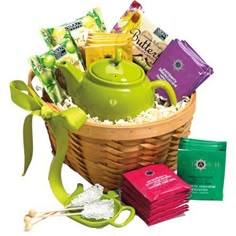 a basket filled with tea, candy and candies