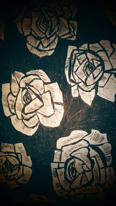 a drawing of flowers on a black background