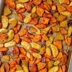 roasted carrots and potatoes on a baking sheet