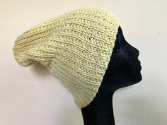 Letter sizes are an estimate- see numerical measurements and info about ease/fit below Gender neutral adult size medium super slouch fitting lightweight beanie hat hand knit in ribbed stitch from 100% wool yarn in a beautiful pastel yellow. Drapes and stretches nicely due to ribbing. Natural fiber is soft and breaths well while providing unparalleled warmth. Great hat for cold weather. Unstretched flat actual item measurements (compare to head size for best fit): Hat band 19 inches around Height is 11 inches tall Will stretch an extra 2-3 inches Care instructions: Hand wash cold, lay flat to dry. Ease is the amount of room a garment allows the wearer beyond the measurements of their body. For example, if your waist measures 30 inches, and the waist of the garment you want to buy also measu Casual Knit Bonnet One Size Fits Most, Casual Hand Knitted One Size Bonnet, Casual Crochet Cap With Knit Fabrication, Casual Fitted Knitted Bonnet, Casual Crochet Knit Cap, Casual Slouchy Yarn Beanie, Hand Knitted Casual Bonnet One Size, Handmade Casual Fitted Hats, Casual Slouchy Knitted Hats