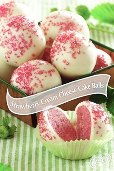 strawberry cream cheese cake balls in a green container with red sprinkles on top