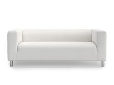 a white couch sitting on top of a white floor