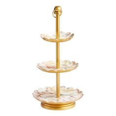 three tiered cake stand with two plates on it