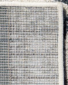 the texture of an area rug is shown in grey and white colors, with two rows of squares on each side