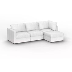 a white couch sitting on top of a white floor