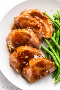 chicken and green beans on a white plate