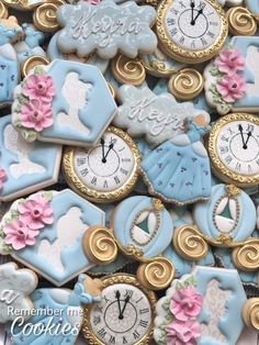 many decorated cookies with clocks and flowers on them