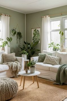 a living room filled with lots of white furniture and plants on the windows sill