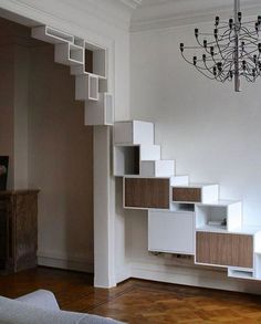 a room with some shelves and a chandelier