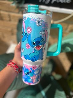 -Sublimated  -40oz  capacity -Keep hot  drinks for 5 hrs and cold  drinks for 10hrs -BPA free -comfort grip handle  -Reusable Straw NO LOGO INCLUDED THIS CUP IS A DUPE NOT A REAL BRAND NAME - Slight imperfections can occur although I do try to replicate as best I can- Stitch Stuff To Buy, Stitch Stanley Cup, Cute Stitch Stuff, Stitch Tumbler Cup, Stitch Stanley, Stitch Cups, Stitch Cup, Lilo And Stitch Toys, Stitch Things