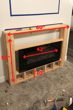 an unfinished entertainment center is shown with measurements for the top shelf and bottom shelf area