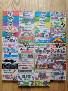 a piece of paper with many different types of stickers all over it on a wooden surface