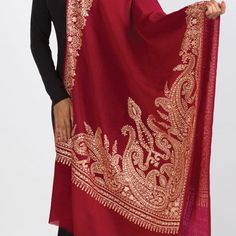 Our new Durga Embroidered Shawl features exquisite embroidery on soft 100% merino wool. With a stunning paisley design, this classically beautiful shawl showcases the intricate embroidery traditions of Northern India in rich gold tones on a burgundy red base. The high quality and elegance of these embroidered shawls make them treasures that will last for generations. Luxury Jamawar Pashmina Shawl For Traditional Ceremonies, Luxury Semi-stitched Handloom Shawl, Luxury Handloom Traditional Drape Shawl, Luxury Elegant Embroidered Pashmina Fabric, Luxury Handmade Shawl For Gift, Luxury Traditional Shawl Scarf, Luxury Elegant Shawl With Intricate Embroidery, Luxury Dupatta Shawl With Motifs, Elegant Unstitched Shawl For Eid