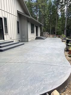 a concrete patio in front of a house