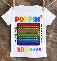 A fun, unique 100th day of school Pop It shirt. All shirts are 100% cotton.  I use a professional heat press to transfer the image, NOT a home iron.  I use high quality shirts from ARB Blanks.  These are very soft shirts, not thin undershirts. Please see the size chart below for the t-shirts and choose your options in the drop down menus. *Please note heat pressed shirts may become distressed through wash/wear.  Always wash them inside out on a delicate cycle using mild detergent and no bleach. 100 Day Of School, Heat Press Shirts, Outfits Baggy, School Gym, It Shirt, 100th Day Of School, School Fits, 100 Days Of School, Pop It