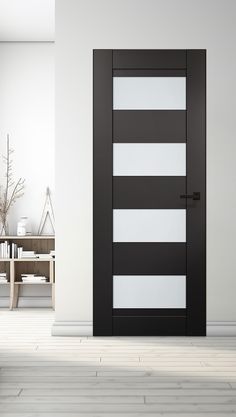 an empty room with a black and white striped door in the center, next to a coffee table