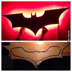 the bat symbol is lit up in red and yellow light, while another photo shows it's shadow