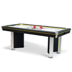 the air hockey table is shown in black and white with yellow trimmings on it