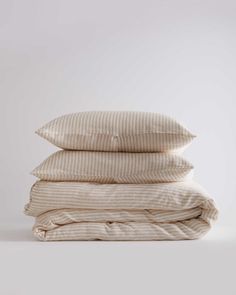 three pillows stacked on top of each other