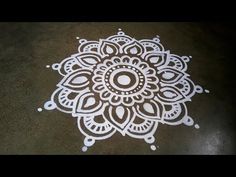 an intricate design is shown on the ground