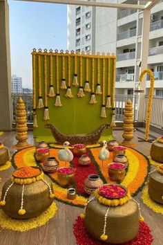 an outdoor decorated with flowers and potted plants